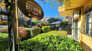 A restaurant sign with "EST. 1996" and "RESTAURANT" visible. - T & G Apartments (Marmaris)