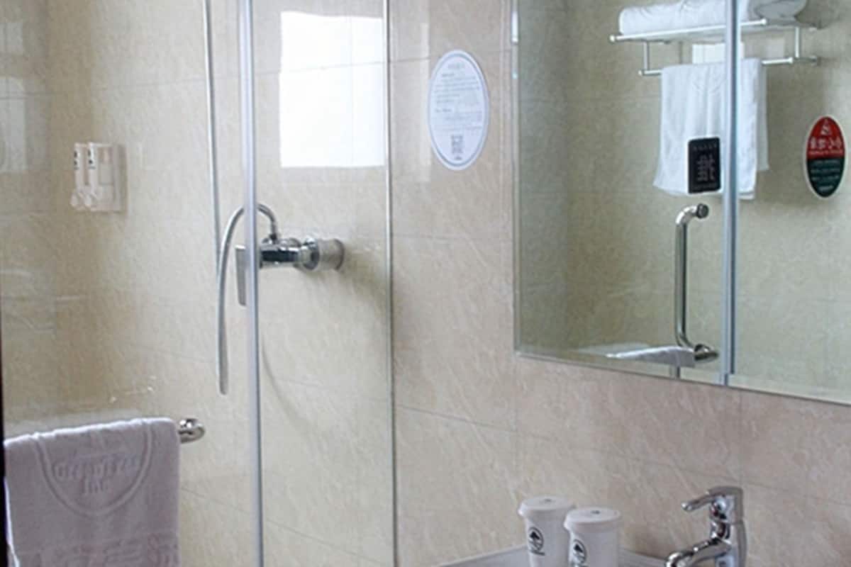 Shower, free toiletries, hair dryer, slippers