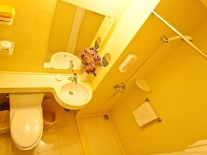 A bathroom with a yellow theme, including a sink, toilet, and shower area. - Greentree Inn Nanjing China Gate Subway Station Express (Nanjing)
