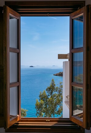 An open window with a view of the sea and distant islands. - Allotina Houses (Patmos)