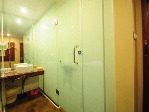 A bathroom with a glass shower enclosure, a sink, and a toilet. - GreenTree Inn HeFei DaPuTou KeXueDao Road Express Hotel (Hefei)