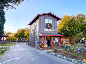 A building with a sign reading "OFFICE & REGISTRATION" and a wreath on the door. - 49'er Village RV Resort (Plymouth)