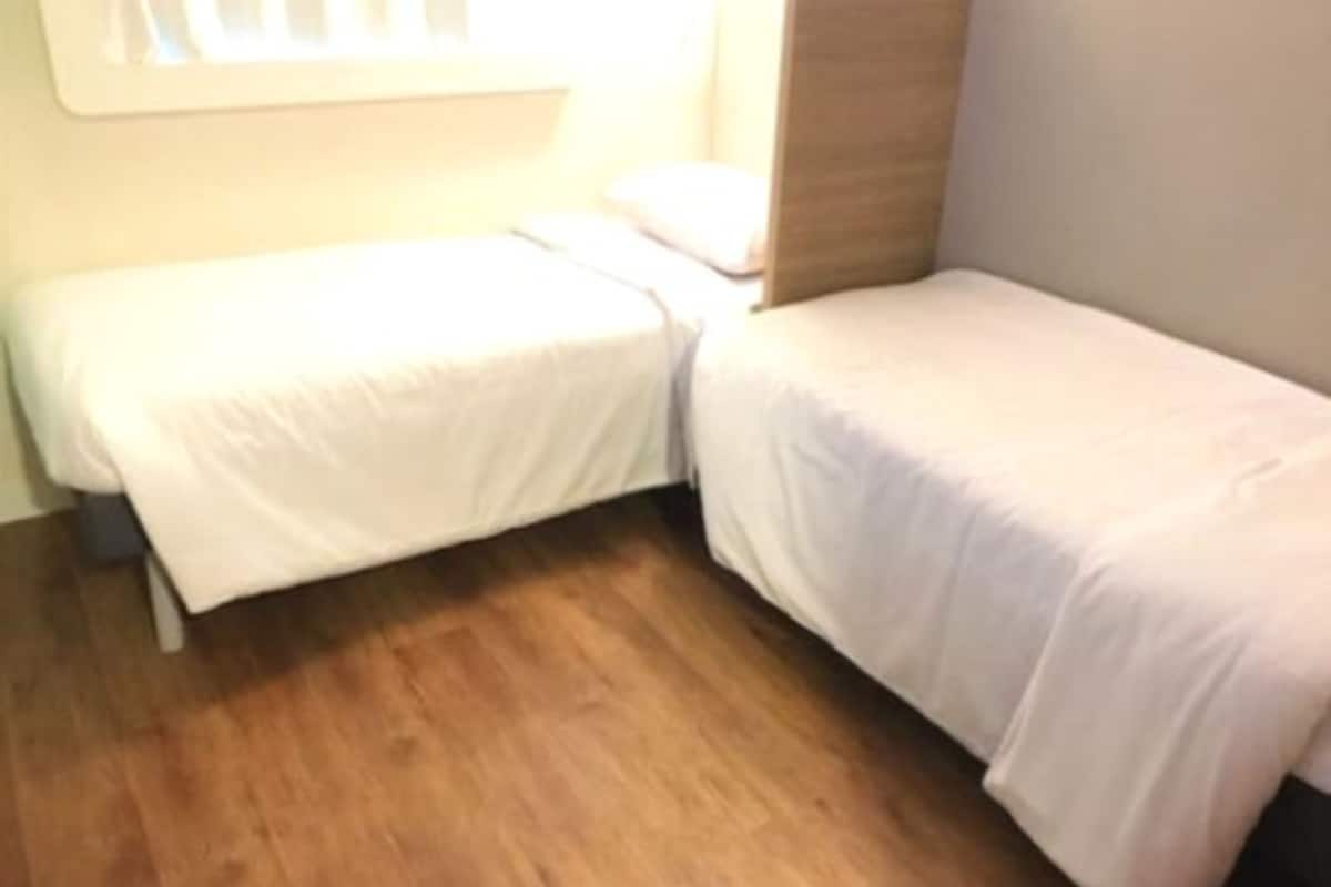 classic twin room, 2 single beds | desk, blackout curtains, soundproofing, free cots/infant beds