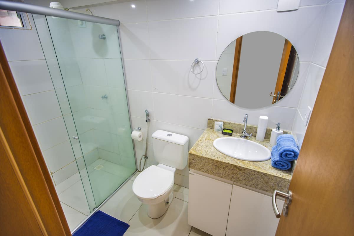 luxury studio suite, 1 bedroom, kitchen, partial sea view | bathroom | shower, towels, toilet paper