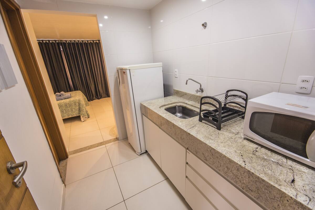 luxury studio suite, 1 bedroom, kitchen, partial sea view | private kitchen