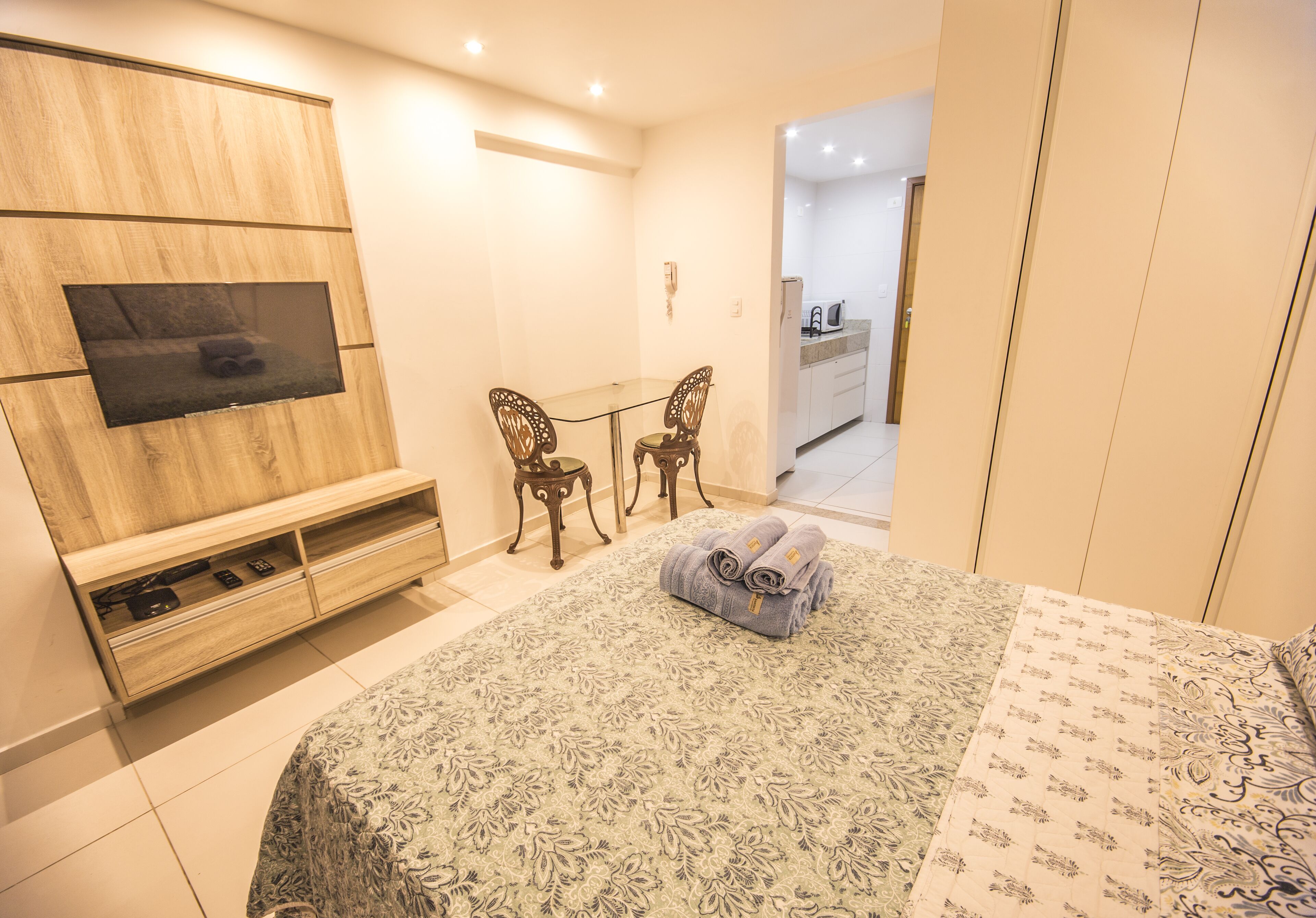luxury studio suite, 1 bedroom, kitchen, partial sea view | blackout curtains, soundproofing, iron/ironing board, free wifi