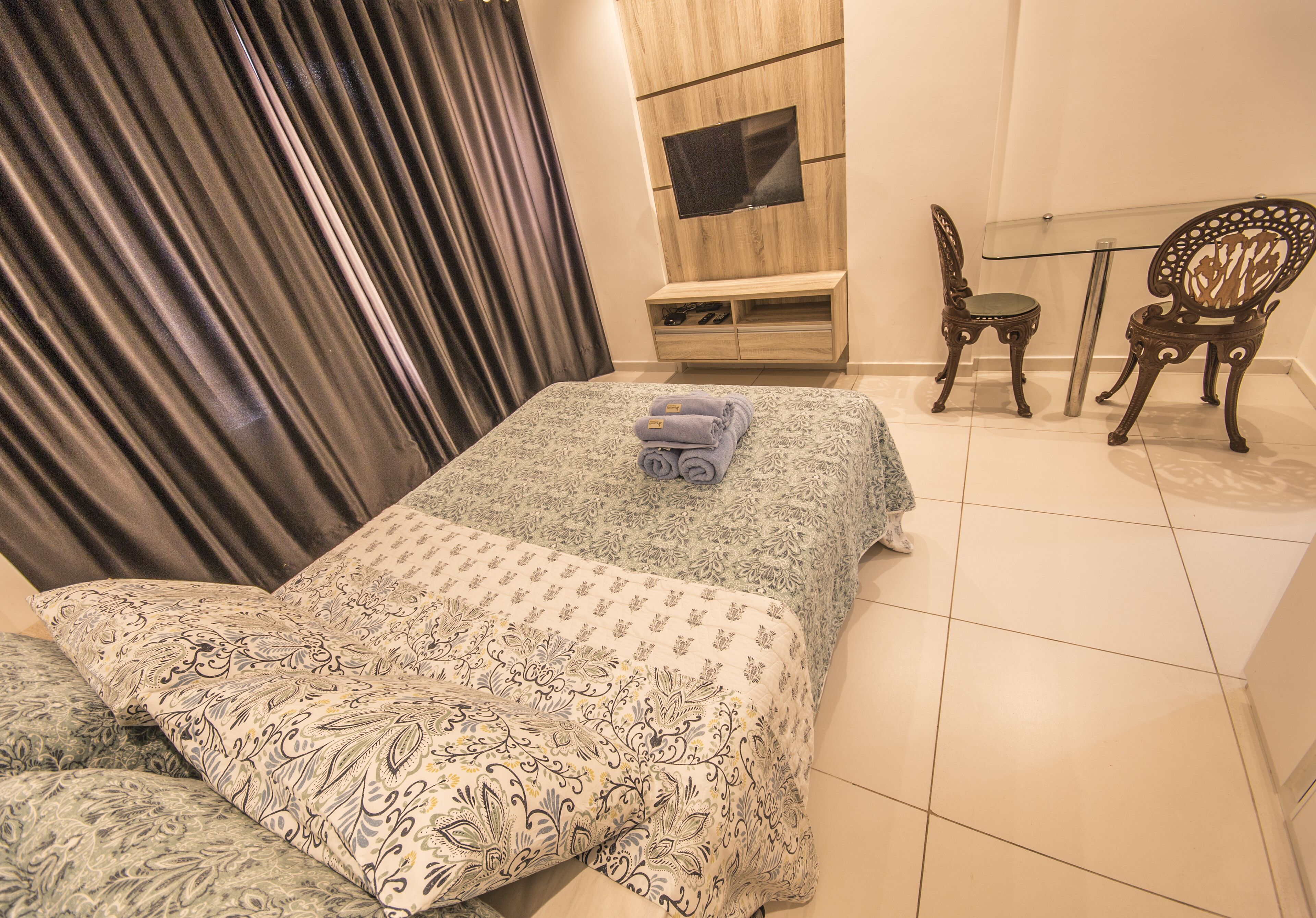 luxury studio suite, 1 bedroom, kitchen, partial sea view | blackout curtains, soundproofing, iron/ironing board, free wifi