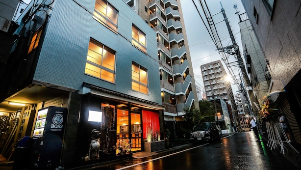 A multi-story building with a ground-floor coffee shop and a visible staircase leading to the upper floors. - Asakusa No Yado Hanaakari (Tokyo)
