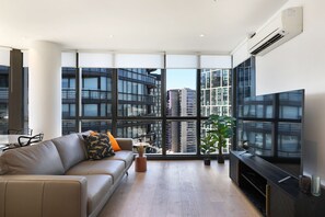 Three Bedroom Two Bathroom Executive Apartment | Living area | Flat-screen TV - Orange Stay Apartments (Docklands)