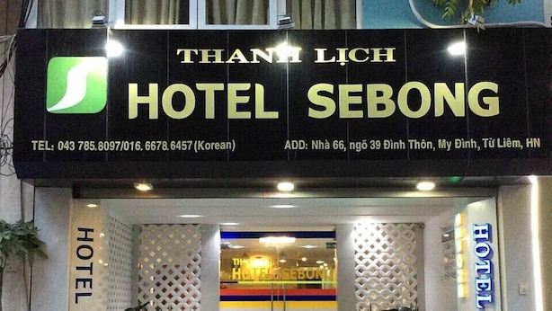 The exterior of Hotel Sebong with a signboard displaying the name and contact information. - Sebong Hotel (Hanoi)