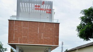 A modern building with a sign reading "Sree Annamalayan Park."