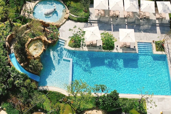 Outdoor pool, open 7:00 AM to 10:00 PM, pool umbrellas, sun loungers