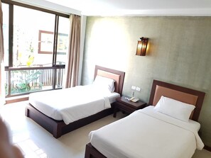 Quarto duplo superior | Frigobar, camas extras/dobráveis (sobretaxa), Wi-Fi de cortesia