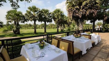 Breakfast, lunch, dinner served; Thai cuisine, golf course views