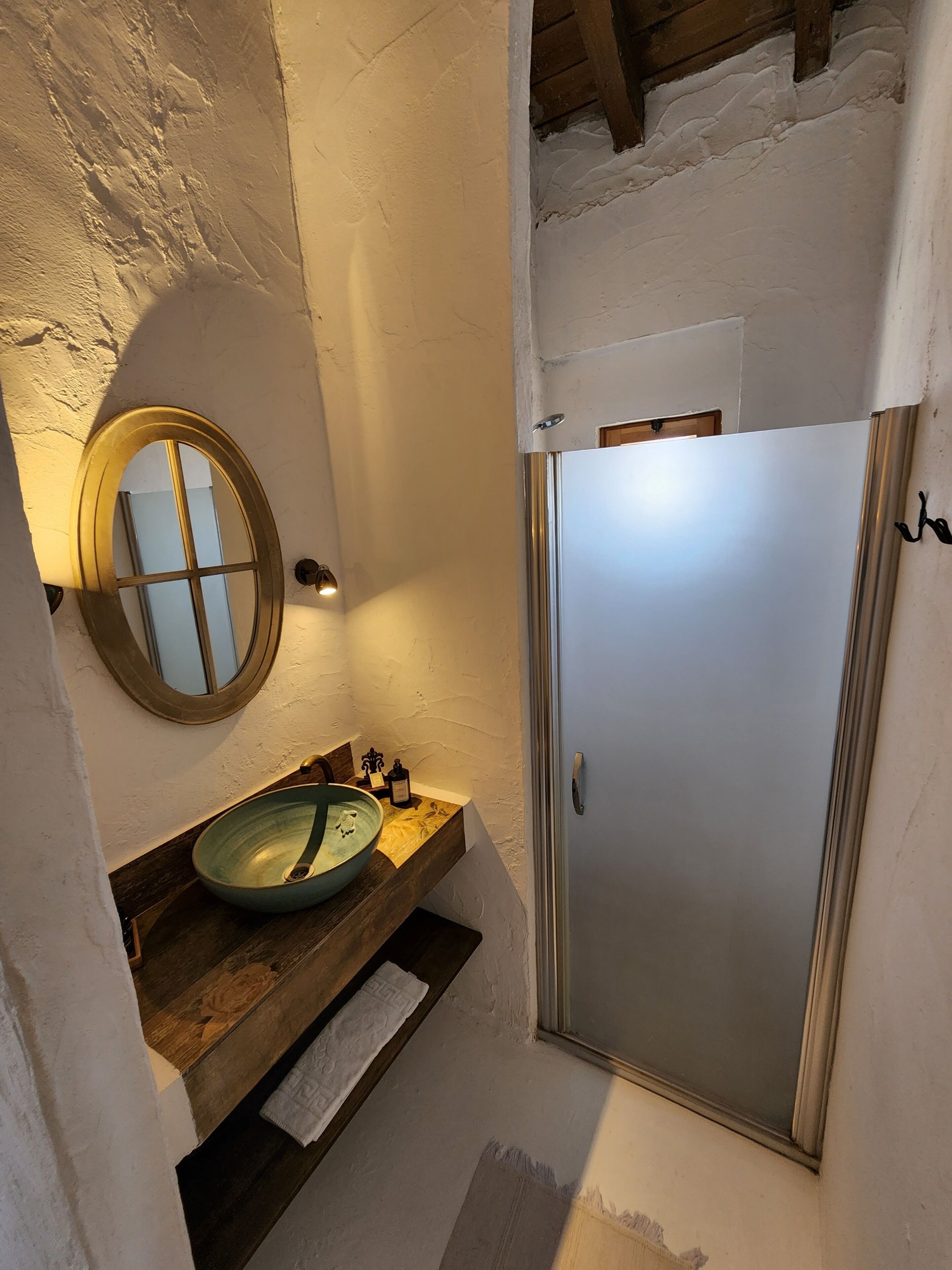 deluxe suite | bathroom | shower, designer toiletries, hair dryer, slippers