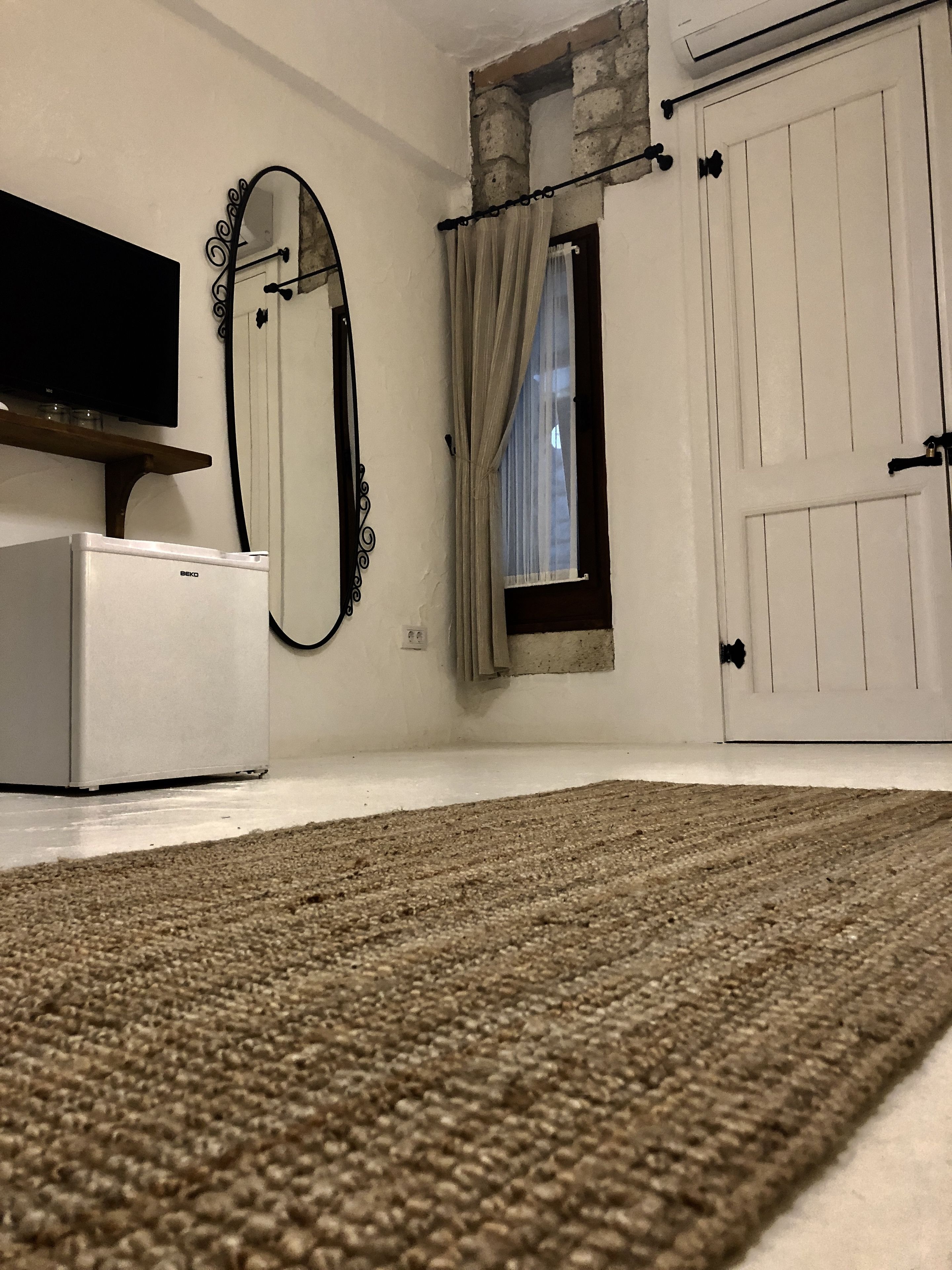 economy double room, no windows, ground floor | minibar, in-room safe, iron/ironing board, free wifi