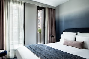 Habitació estàndard | Roba de llit d'alta qualitat i caixa forta a l'habitació 