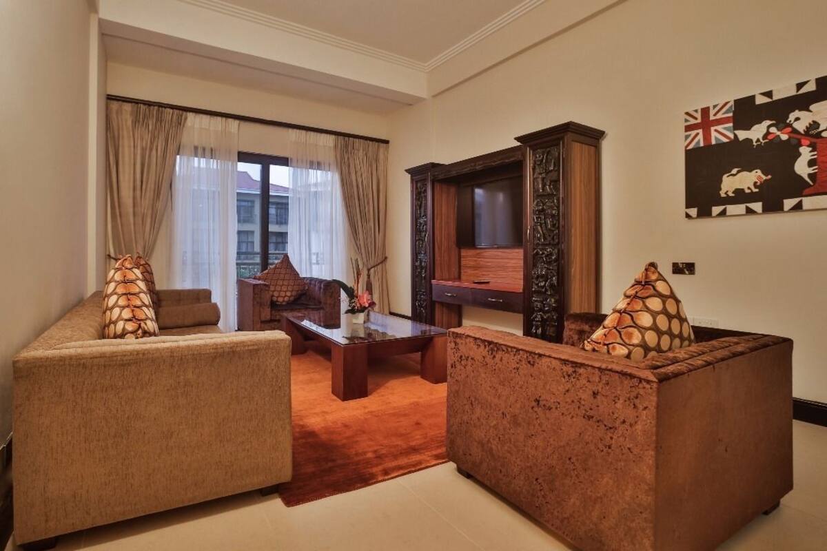 Presidential Suite | Living area | 40-inch flat-screen TV with cable channels, TV, pay movies