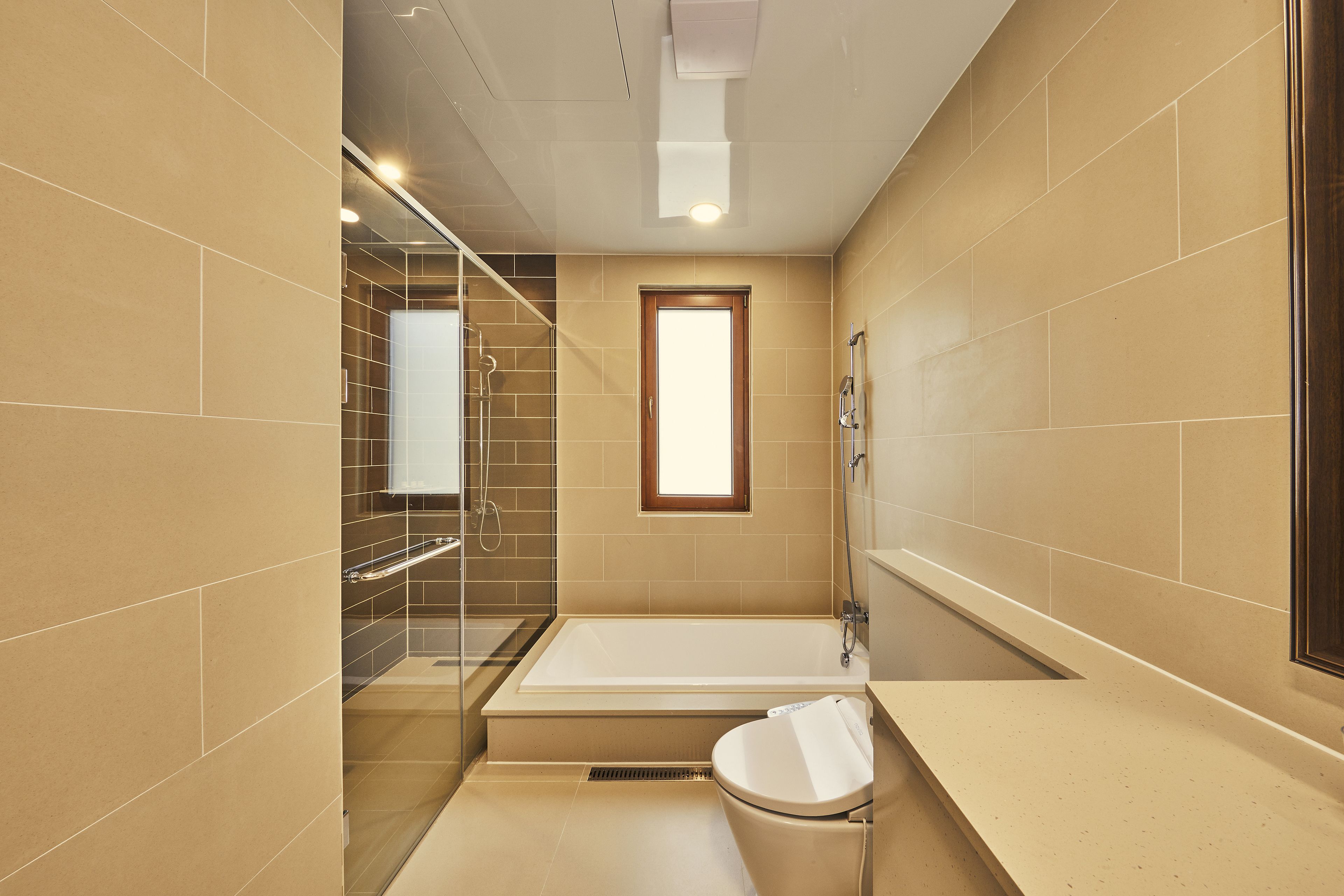 shower, designer toiletries, hair dryer, slippers