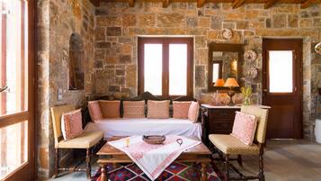 Traditional Stone Studio | Living area | LCD TV, fireplace, DVD player