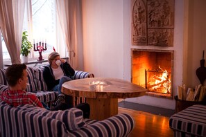 Cozy space with a fireplace, comfortable seating, and a simple design for relaxation.