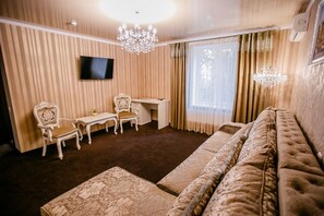 Luxury Suite, 1 Bedroom | Living area | Flat-screen TV