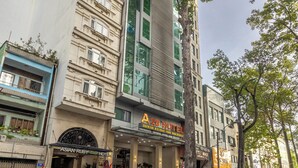 A hotel with a modern facade, multiple floors, and a prominent entrance. - A25 Premium Hotel - 20 Bui Thi Xuan (Ho Chi Minh City)