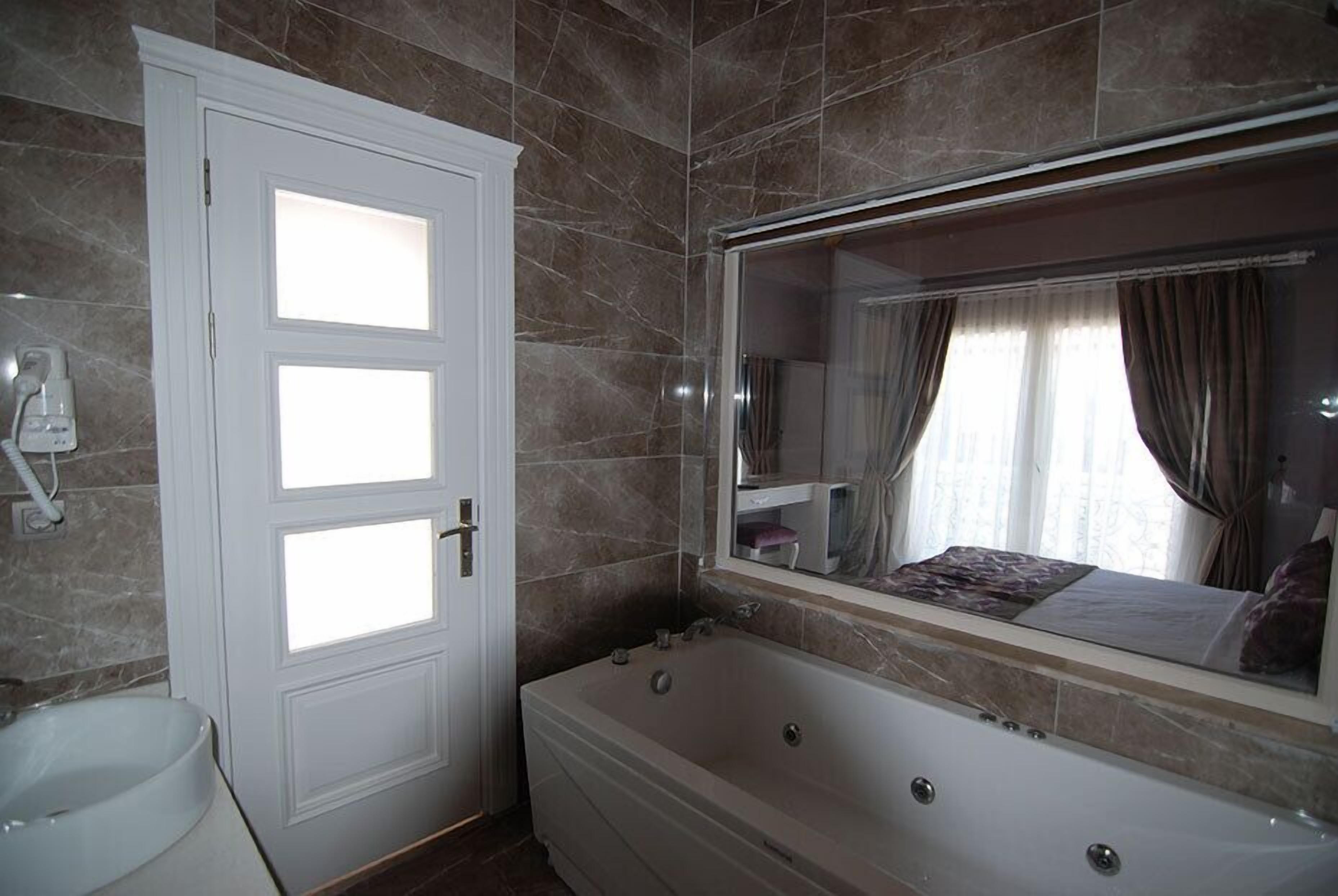 design room, pool view | premium bedding, minibar, in-room safe, desk