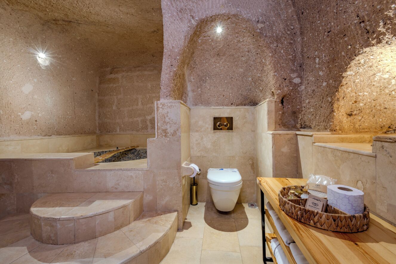 Honeymoon King Suite | Bathroom | Designer toiletries, hair dryer, bathrobes, slippers