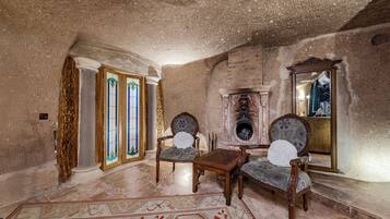 Deluxe Suite with Chimney | Living area | LCD TV, heated floors