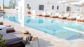 Seasonal outdoor pool, pool umbrellas, pool loungers