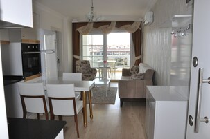 Deluxe Studio Suite, 1 Bedroom | Living area | LCD TV