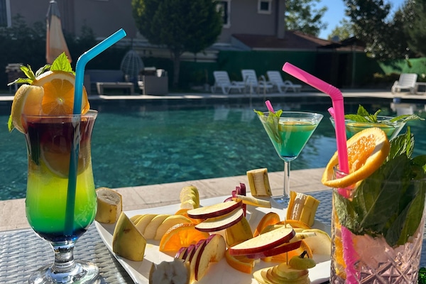 Indoor pool, outdoor pool, pool umbrellas, sun loungers