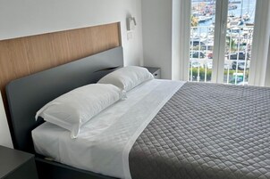 Quadruple Room | Premium bedding, minibar, in-room safe, individually decorated