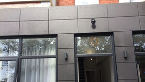 A building facade with large windows, a security camera, and a visible door. - Sweet Suites Lytham St Annes (Lytham St. Anne's)
