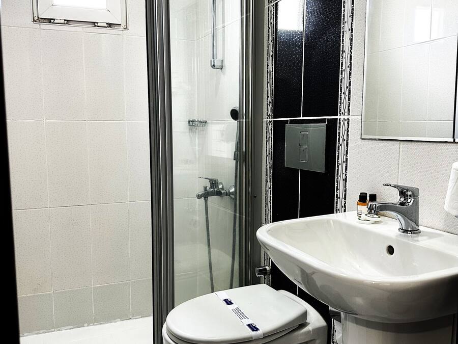 Shower, free toiletries, hair dryer, slippers