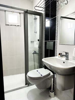Shower, free toiletries, hair dryer, slippers
