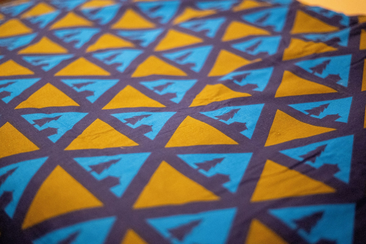 A close-up of a patterned fabric with geometric shapes.
