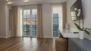 Superior Suite, Sea View | Living area | Flat-screen TV