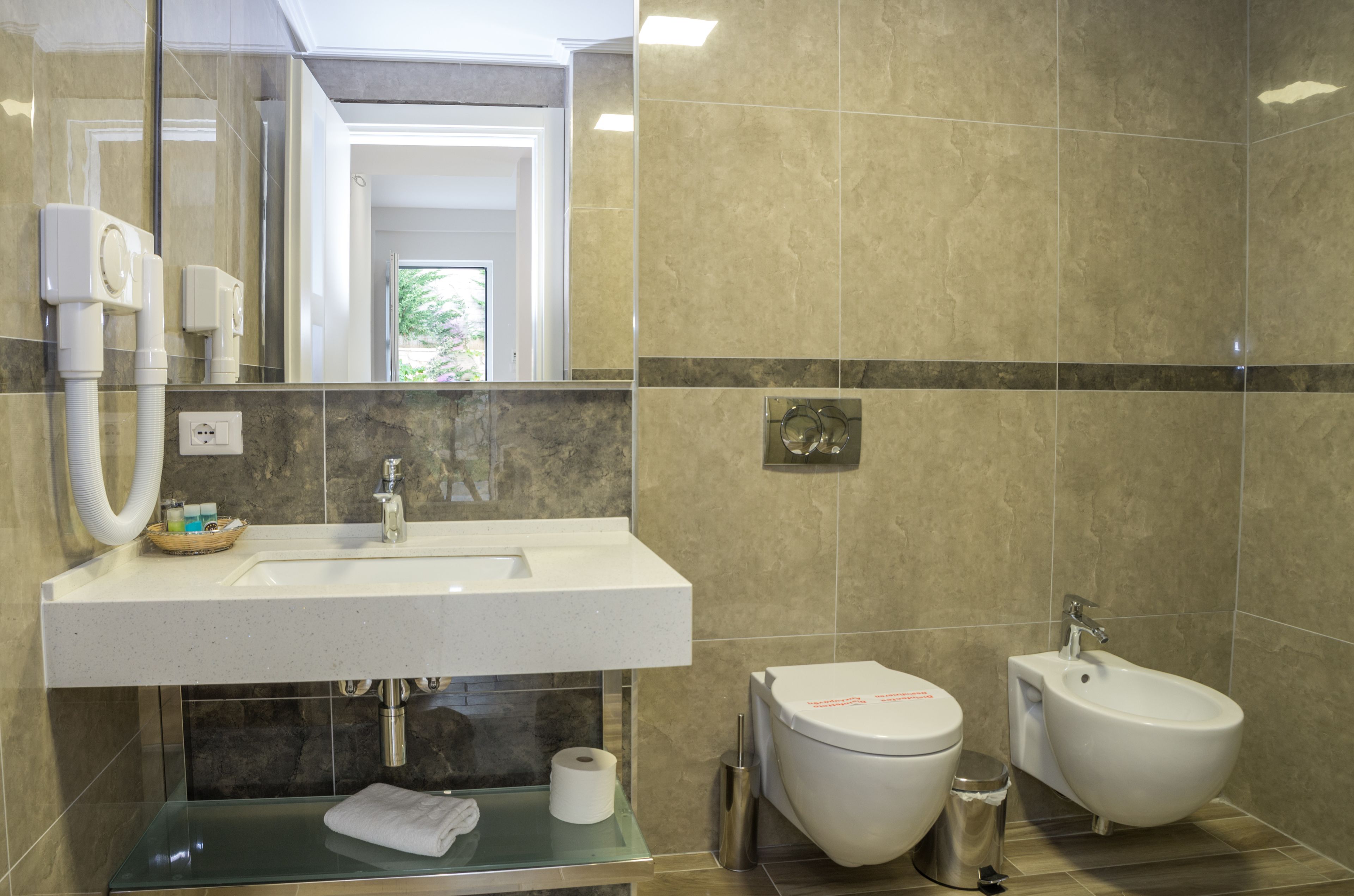 quadruple room, partial sea view | bathroom | free toiletries, hair dryer, slippers, towels