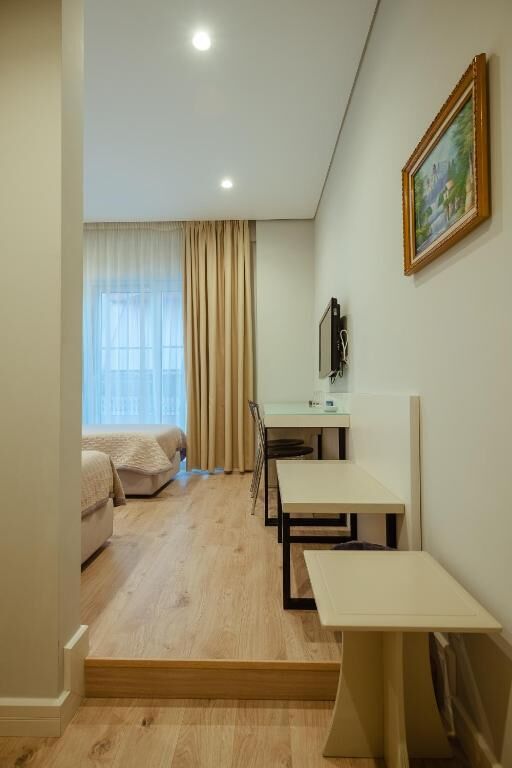 Deluxe Twin Room, City View | Hypo-allergenic bedding, in-room safe, desk, blackout curtains