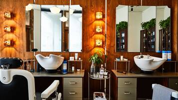 A modern bathroom with two sinks, wooden paneling, and a mirror cabinet.