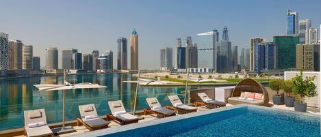 Outdoor pool, open 8:00 AM to 10:00 PM, pool umbrellas, pool loungers