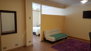 Standard Apartment, 1 Double Bed | Living area | Flat-screen TV