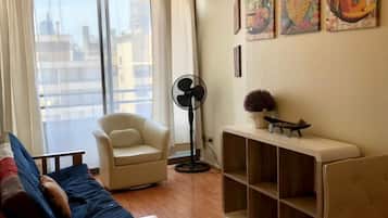 Standard Apartment, 1 Double Bed | Living area | Flat-screen TV