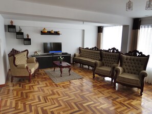 Apartment, 3 Bedrooms, 2 Bathrooms (QW3) | Living area | Flat-screen TV - Apartamentos Quewe (Cusco)