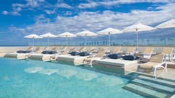 Outdoor pool, open 8 AM to 8 PM, pool umbrellas, pool loungers