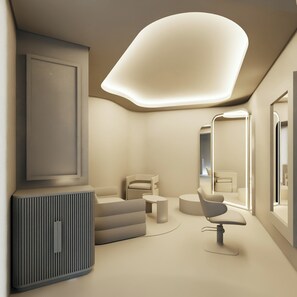 A modern interior with a large mirror, a sofa, and a chair. -  Devossion By Live Aqua Celebration Resort & Spa Isla Mujeres All Inclusive (Isla Mujeres)