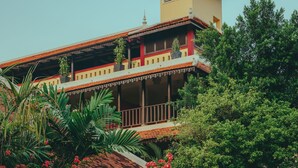 A two-story building with a balcony and a small tower-like structure on top. - Pandora Suite D'Angkor (Siem Reap)