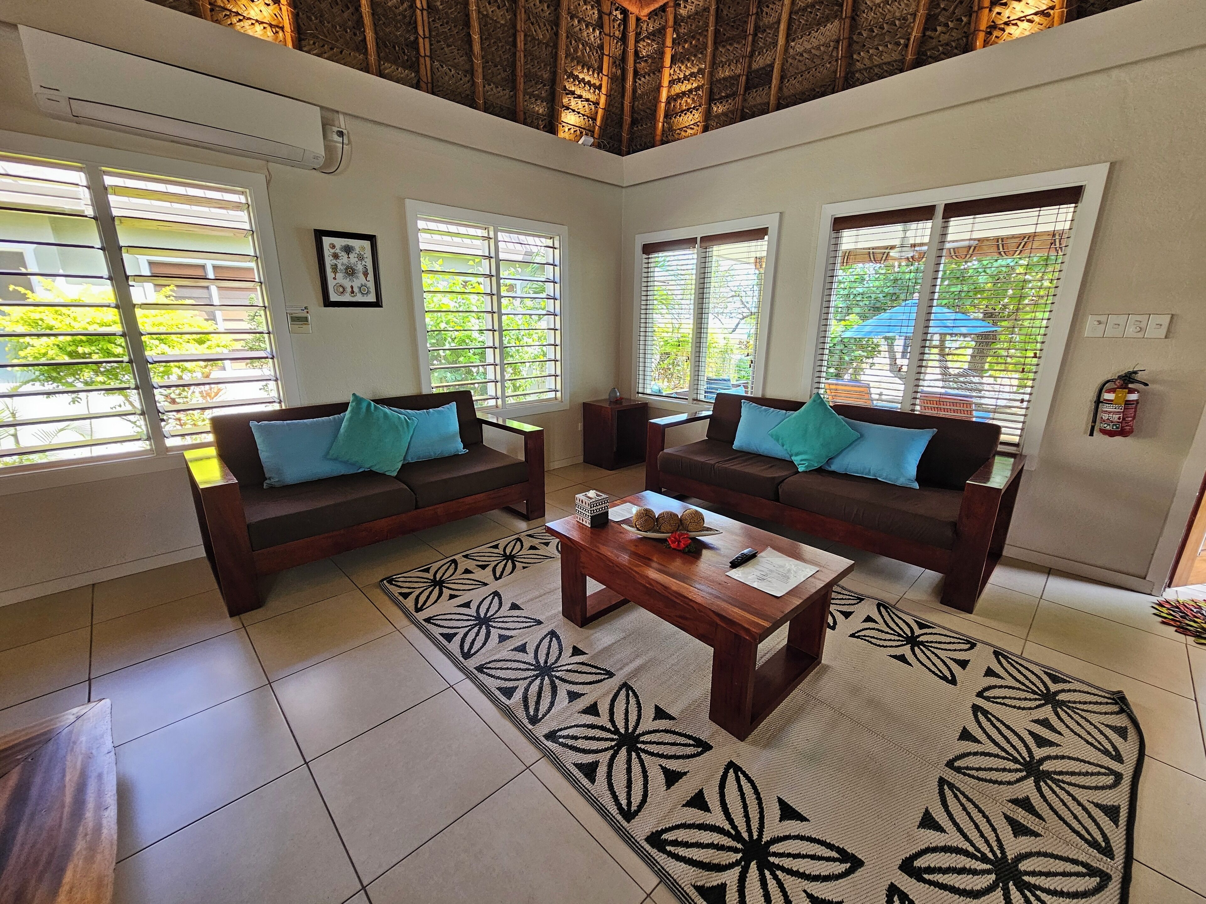 palms villa (two bedroom beachfront) | living area | 40-inch smart tv with digital channels, netflix, streaming services